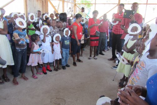 The Children start out shy but soon all are making crafts and proudly display them